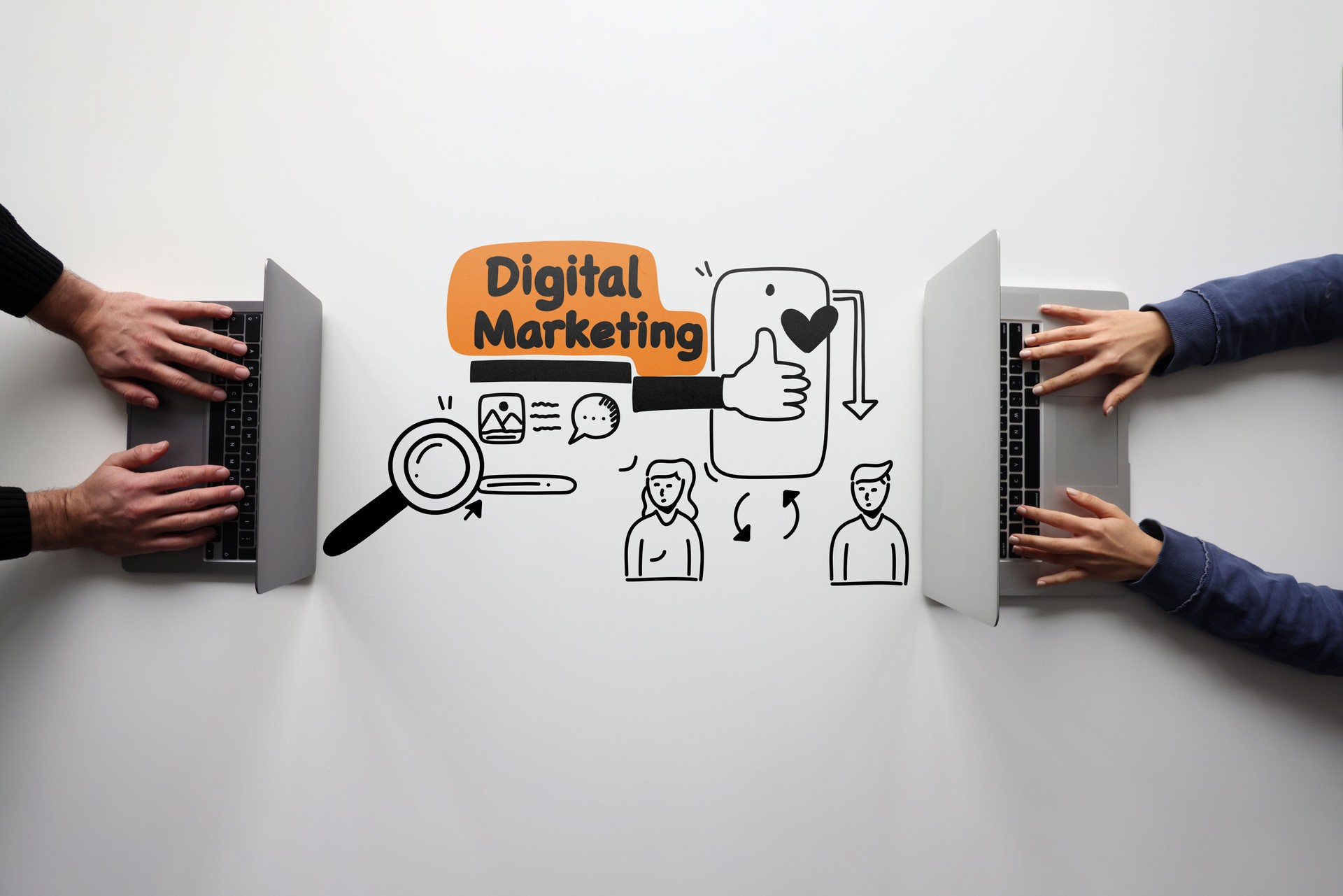 Two people trying to create digital content on their computers with line icons